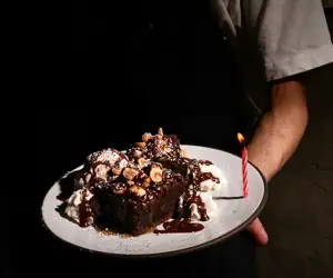 Delicious chocolate dessert with a birthday candle at La Lupa restaurant. 
