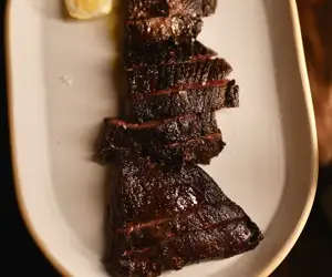Grilled to perfection, sliced steak from La Lupa. 